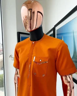 A Fire orange, combat pocket with matching paisley and Swarovski button detailing african traditional senator kaftan native.
