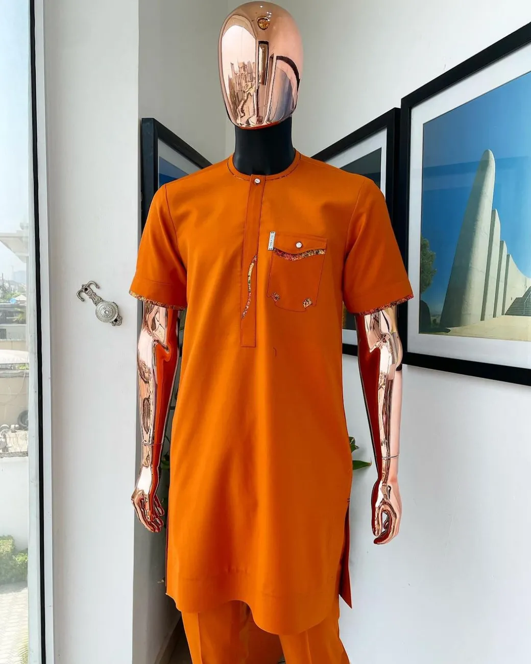 A Fire orange, combat pocket with matching paisley and Swarovski button detailing african traditional senator kaftan native.