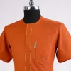A fire Orange, front flap with paisley and perspective layered pocket detailing african traditional senator kaftan native.