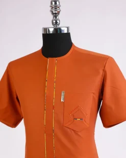 A fire Orange, front flap with paisley and perspective layered pocket detailing african traditional senator kaftan native.