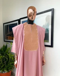A Flamingo pink, monochrome spiral embroidery detailing Agbada