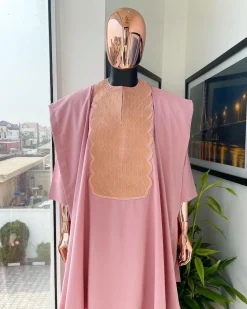 A Flamingo pink, monochrome spiral embroidery detailing Agbada