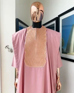 A Flamingo pink, monochrome spiral embroidery detailing Agbada