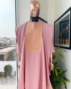 A Flamingo pink, monochrome spiral embroidery detailing Agbada