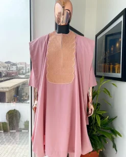 A Flamingo pink, monochrome spiral embroidery detailing Agbada