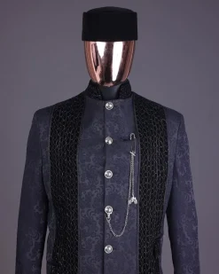A floral midnight blue “wakanda” with L metallic embroidery, trench jacquard safari suit