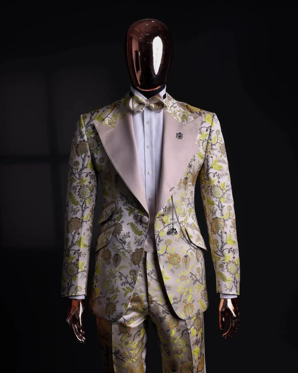 A Floral splashed yellow, mocha and cedar brown, knitted, peak lapel tuxedo suit