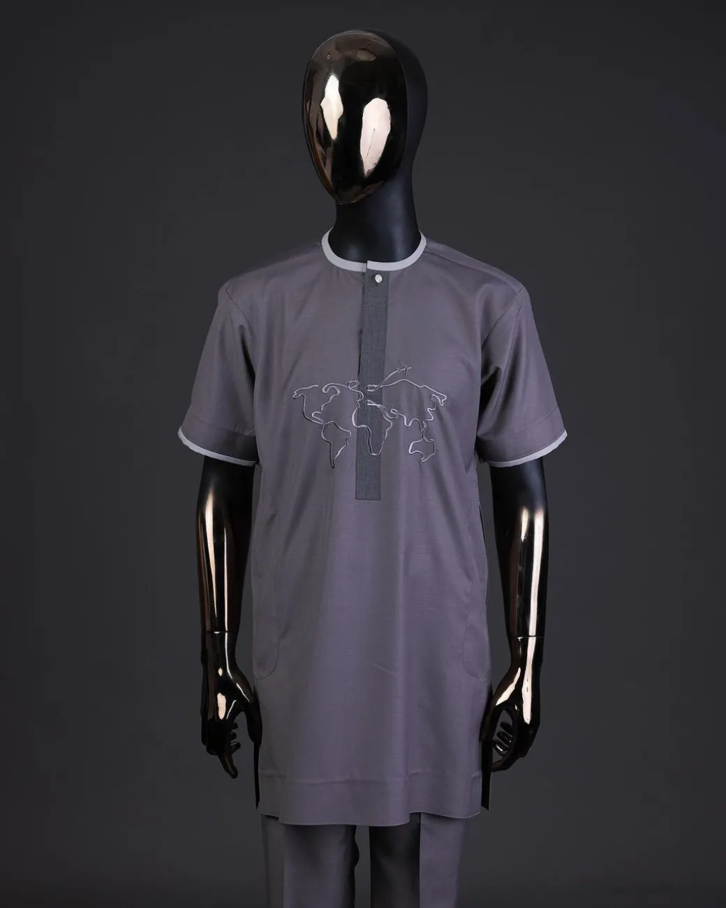 A Fossil grey front flap with crystal Swarovski button, world map embroidery detailing kaftan, and Sokoto