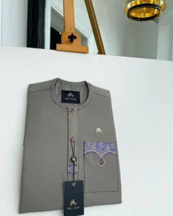 A Fossil Grey, mixed purple Swarovski buttons, vertical flap, knitted embrodery, matching paisley detailing