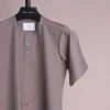 A fossil grey, return front flap with clear view Swarovski button details, short sleeve African senator kaftan native.