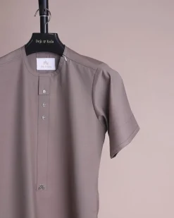 A fossil grey, return front flap with clear view Swarovski button details, short sleeve African senator kaftan native.