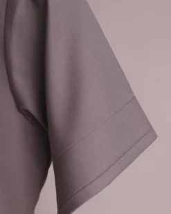 A fossil grey, return front flap with clear view Swarovski button details, short sleeve African senator kaftan native.
