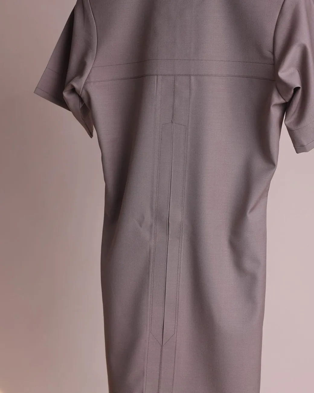 A fossil grey, return front flap with clear view Swarovski button details, short sleeve African senator kaftan native.