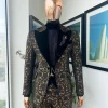 A Gold and black mandarin metallic floral jacquard, peak lapel tuxedo suit.