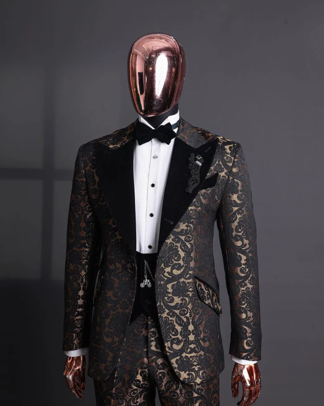 A Gold and black mandarin metallic floral jacquard, peak lapel tuxedo suit