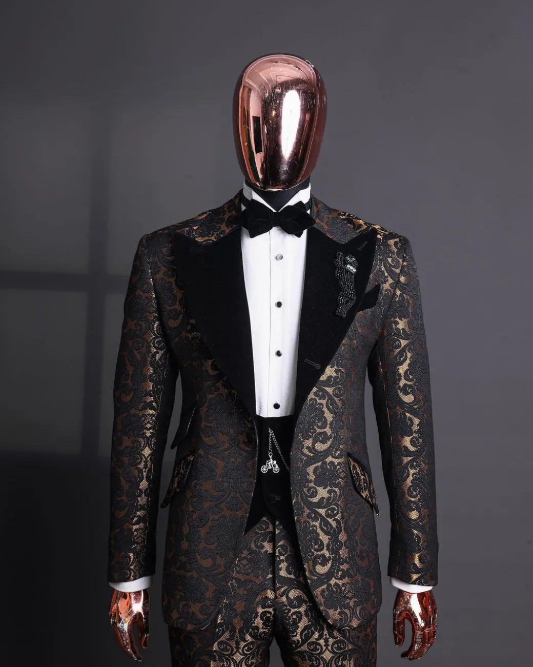 A Gold and black mandarin metallic floral jacquard, peak lapel tuxedo suit