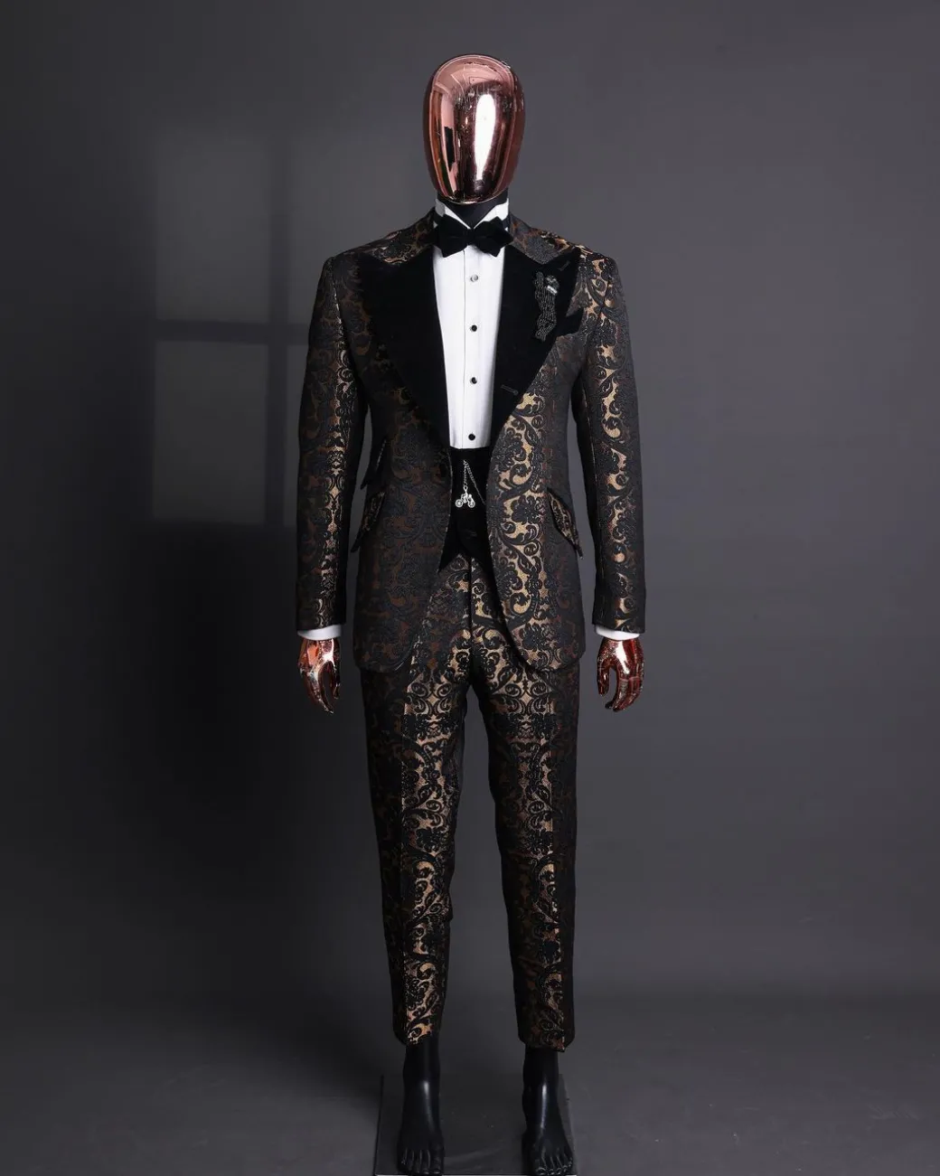 A Gold and black mandarin metallic floral jacquard, peak lapel tuxedo suit