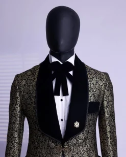 A Gold and black patterned metallic Jacquard tuxedo suit with sharaba wooven edge detailing