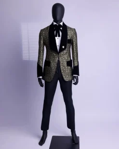 A Gold and black patterned metallic Jacquard tuxedo suit with sharaba wooven edge detailing