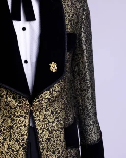 A Gold and black patterned metallic Jacquard tuxedo suit with sharaba wooven edge detailing