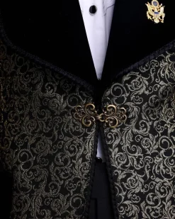 A Gold and black patterned metallic Jacquard tuxedo suit with sharaba wooven edge detailing