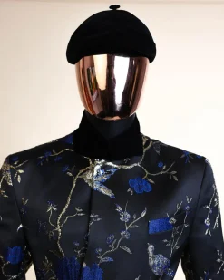 A Gold, black and blue double breasted safari suit, raven and forest metallic pattern jacquard