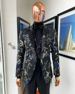 A Gold, black, and blue peak lapel, raven, and forest metallic pattern jacquard dinner suit