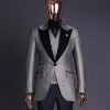 A Gold, black and silver mix metallic jacquard, peak lapel tuxedo suit