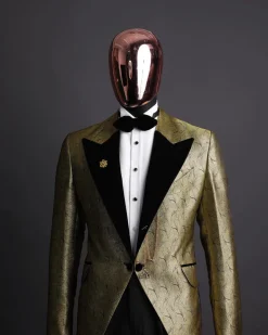 A gold metallic jacquard peak lapel tuxedo suit