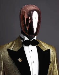 A gold metallic jacquard peak lapel tuxedo suit