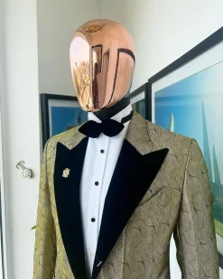 A gold metallic jacquard peak lapel tuxedo suit