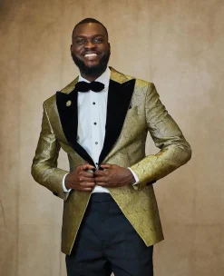 A gold metallic jacquard peak lapel tuxedo suit