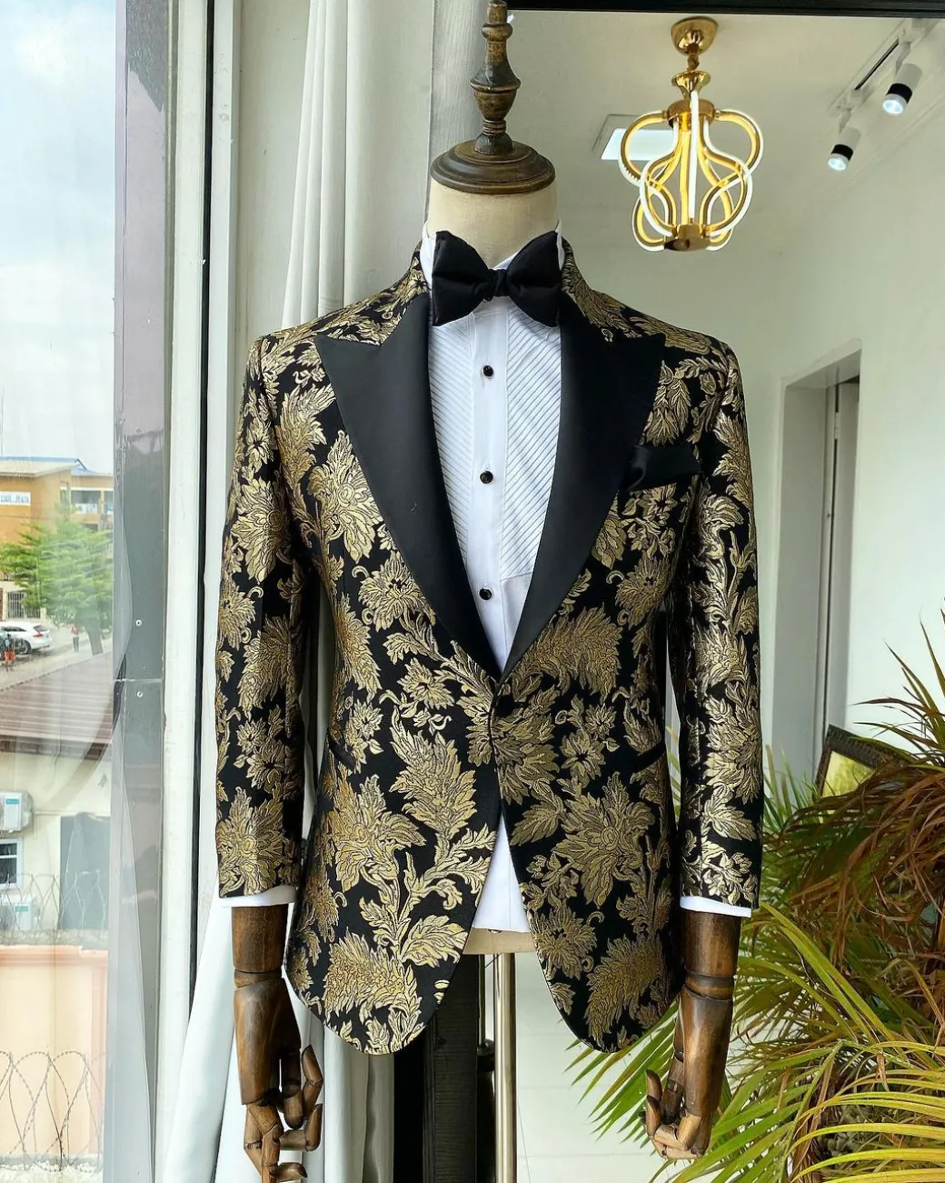 A Gold Patterned Jacquard Peak Label tuxedo suit
