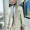 A gold print pattern tuxedo suit, contemplation cream with maroon, champagne gold floral metallic jacquard shawl lapel