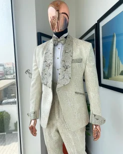 A gold print pattern tuxedo suit, contemplation cream with maroon, champagne gold floral metallic jacquard shawl lapel