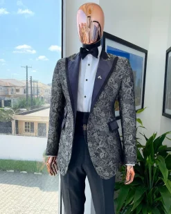 A grey floral jacquard, peak lapel with black silk taping tuxedo suit