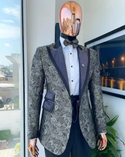 A grey floral jacquard peak lapel with black silk taping tuxedo suit