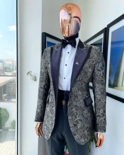 A grey floral jacquard, peak lapel with black silk taping tuxedo suit