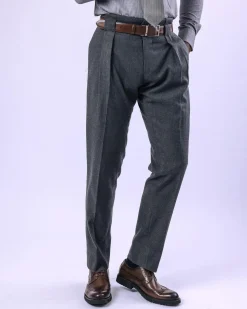 A Grey Gurkha pant with a covered belt tab and double pleats.
