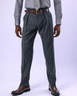 A Grey Gurkha pant with a covered belt tab and double pleats.
