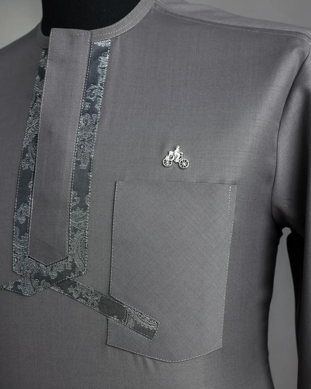 A Grey, matching slanted paisley, front flap, 3/4-sleeve African senator kaftan native.