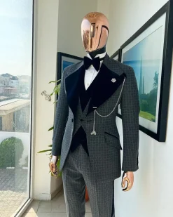 A grey octagonal patterned, navy blue mix, wide notch lapel, single button suit