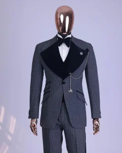 A grey octagonal patterned, navy blue mix, wide notch lapel, single button suit