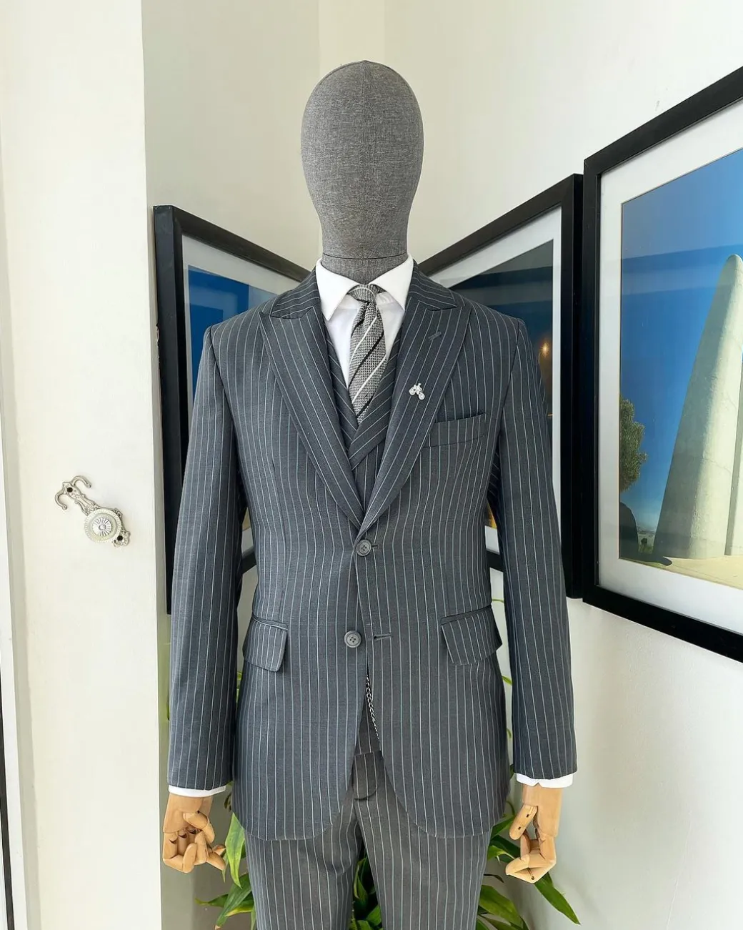 A Grey pencil stripe peak lapel suit, double-breasted notch lapel suit