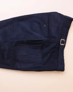 A “Gurkha”pant shorts with pleats, double side strap buckle, combat patch pocket.