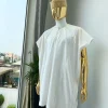A Hand picked (jakan design) ivory white dashiki buba, sokoto & a cream patterned wool hat.