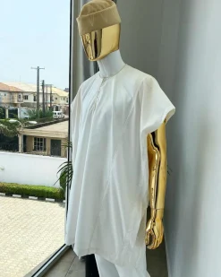 A Hand picked (jakan design) ivory white dashiki buba, sokoto & a cream patterned wool hat.