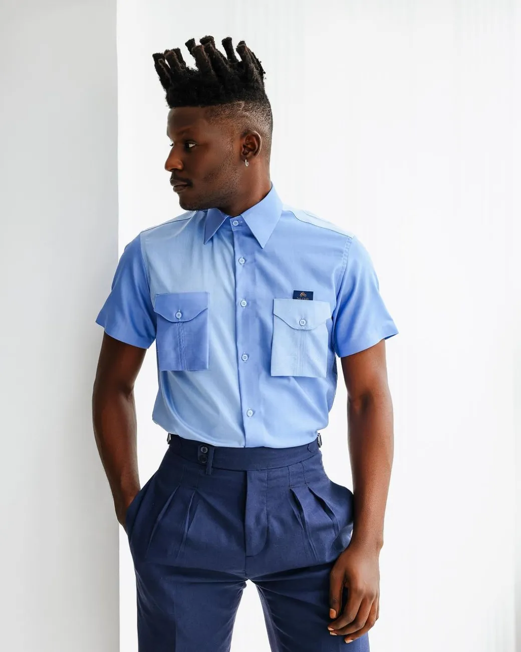 A Herringbone mix shade of blue English spread collar short sleeve casual shirt with double patch pocket.