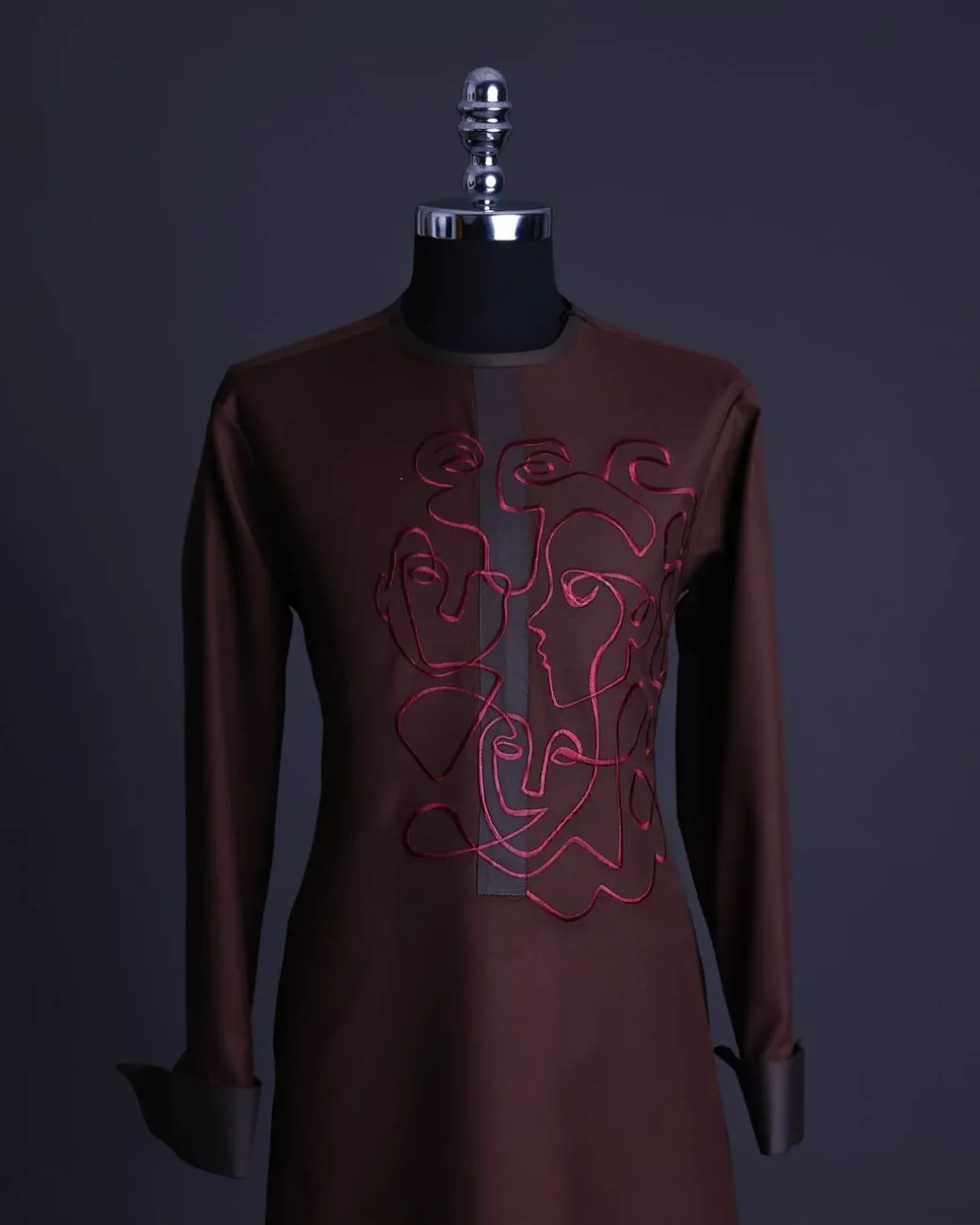 A Hickory Brown, front flap with “Eve Of May” embroidery detailing African senator kaftan native.