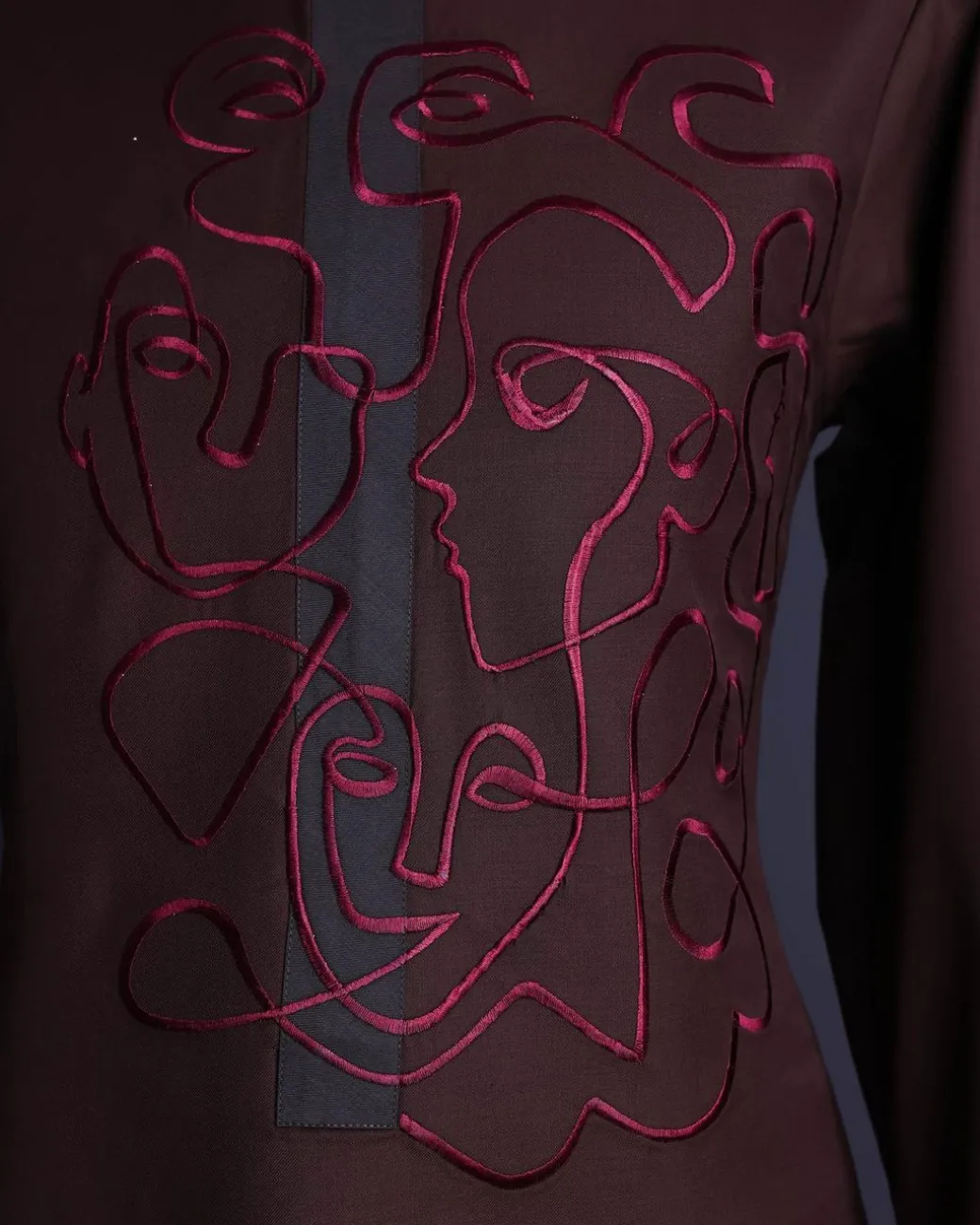 A Hickory Brown, front flap with “Eve Of May” embroidery detailing African senator kaftan native.